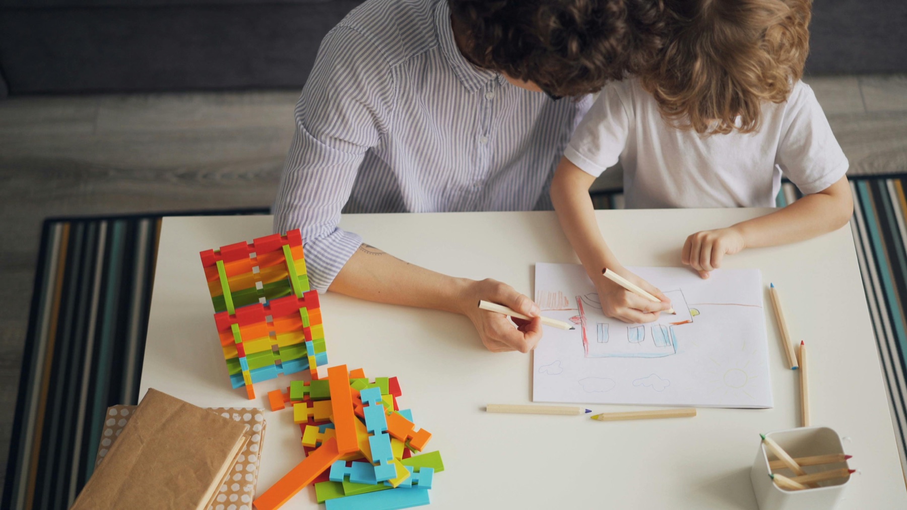 Parent and child planning together at home